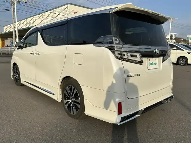 トヨタ ヴェルファイア Z Gエディション 岡山県 2019(平31)年 11.1万km ホワイトパールクリスタルシャイン 登録時走行距離110210km/ワンオーナー/純正8インチナビ/（SD/CD/DVD/Bluetooth）/純正フリップダウンモニター/トヨタセーフティーセンス/・プリクラッシュセーフティ/・レーントレーシングアシスト/・レーダークルーズコントロール/・レーンディパーチャーアラート/・オートマチックハイビーム/・ロードサインアシスト/モデリスタエアロ/ブラインドスポットモニター/パワーシート/エアーシート/シートヒーター/オートブレーキホールド/両側パワースライドドア/純正18インチホイール/ステアリングヒーター/ステアリングスイッチ/プッシュスタート/スマートキー