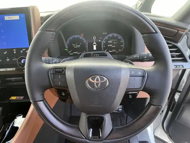 トヨタ ヴェルファイア ハイブリット Z プレミア 福岡県 2025(令7)年 0.1万km プラチナホワイトパールマイカ 純正14インチディスプレイナビ(フルセグTV/Bluetooth)/JBL/後席モニター/レーダークルーズコントロール/トヨタセーフティー/ムーンルーフ/コーナーセンサー/純正三眼LEDヘッドライト/シーケンシャルウィンカー/両側ユニバーサルステップ/全方位カメラ/ブラインドスポット/両側パワスラ/オットマン/電動リアゲート/デジタルインナーミラー/エアシート/シートヒーター/ETC/HDMI/純正フロアマット/純正フォグランプ/純正19インチアルミホイル/スマートキー　スペア1本/ステアリングスイッチ