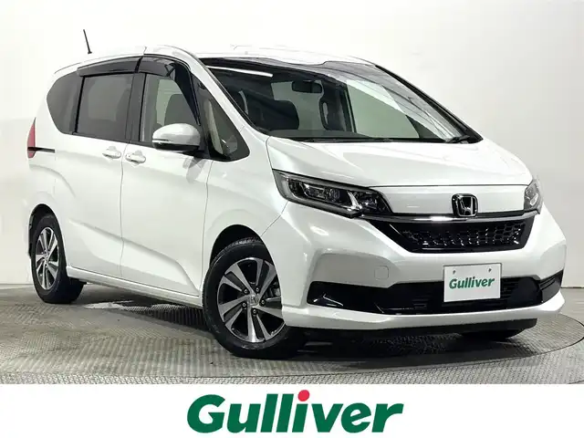 ホンダ フリード G 大阪府 2022(令4)年 0.9万km プラチナホワイトパール ホンダセンシング 社外ナビTV Bカメラ ETC ハーフレザー シートヒーター 両側パワースライドドア 衝突軽減 レーダーC レーンアシスト スマートキー Pスタート 前後ドラレコ ワンオーナー