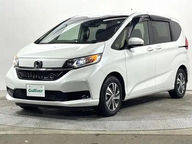 ホンダ フリード G 大阪府 2022(令4)年 0.9万km プラチナホワイトパール ホンダセンシング 社外ナビTV Bカメラ ETC ハーフレザー シートヒーター 両側パワースライドドア 衝突軽減 レーダーC レーンアシスト スマートキー Pスタート 前後ドラレコ ワンオーナー