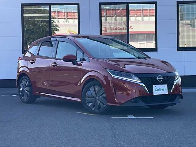 日産 ノート X 山口県 2021(令3)年 4.1万km ガーネットレッド 純正9インチメモリナビ【259156XJ0A】/・フルセグテレビ/・Bluetooth/・Android　Auto/・USB/・HDMI/・AM/FM/ETC2.0/前方ドライブレコーダー/プッシュスタート/スマートキー/アラウンドビューモニター/電動パーキングブレーキ/プロパイロット/スマートルームミラー/LEDヘッドライト/おくだけ充電/タイプC入力端子/シガーソケット/安全装備/・ヒルスタートアシスト/・インテリジェント エマージェンシーブレーキ/・踏み間違い衝突防止アシスト/・標識検知機能/・インテリジェント FCW（前方衝突予測警報）/・LDW（車線逸脱警報）/・インテリジェント DA（ふらつき警報）/・インテリジェント LI （車線逸脱防止支援システム）/・エマージェンシーストップシグナル/・インテリジェント BSI（後側方衝突防止支援システム）/・BSW（後側方車両検知警報）/・RCTA（後退時車両検知警報）/・車両接近通報装置/・イモビライザー