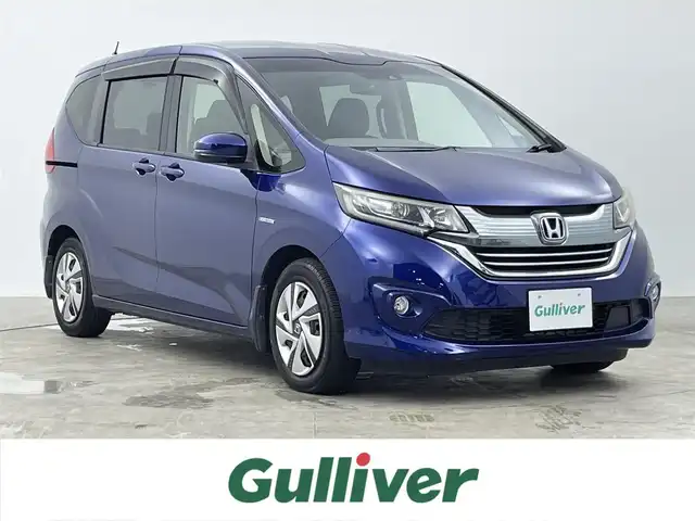 ホンダ フリード ハイブリット G ホンダセンシング 千葉県 2016(平28)年 6.7万km コバルトブルーパール 禁煙車/ホンダセンシング/衝突軽減ブレーキ〈CMBS〉/誤発進抑制機能/ACC〈アダプティブ・クルーズ・コントロール〉/LKAS〈車線維持支援システム〉/歩行者事故低減ステアリング/路外逸脱抑制機能/先行車発進お知らせ機能/標識認識機能/純正ナビ（VXM-175VFi）/CD/DVD/Bluetooth/フルセグ/バックカメラ/両側電動スライドドア/ビルトインETC/ステアリングリモコン/横滑り防止機能/リア席サンシェード/LEDヘッドライト/アクティブコーナリングライト/コンフォートビューパッケージ/Cパッケージ/純正フロアマット/スマートキー