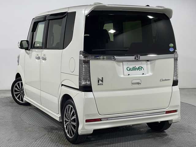 ホンダ Ｎ ＢＯＸ カスタム G ターボ Lパッケージ 広島県 2016(平28)年 4.2万km プレミアムホワイトパールⅡ 純正8型ナビ（DVD/Bluetooth/フルセグTV）/両側パワースライドドア/バックカメラ/衝突軽減ブレーキ/誤発進抑制機能/クルーズコントロール/HIDヘッドランプ/オートライト/パドルシフト/ステアリングスイッチ/ハーフレザーシート/純正15インチAW/ビルトインETC/ドライブレコーダー/スマートキー
