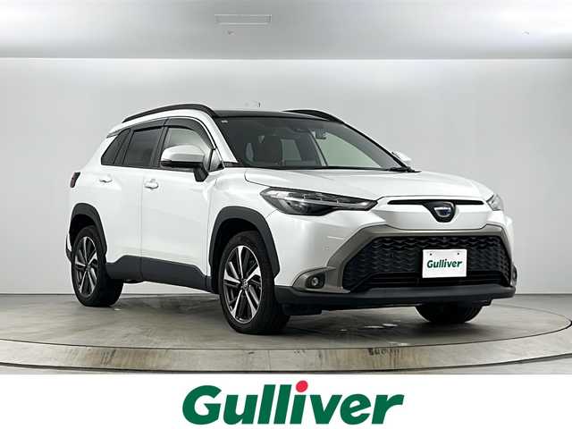 トヨタ カローラ クロス ハイブリッド Z 愛知県 2021(令3)年 4.3万km プラチナホワイトパールマイカ パノラマルーフ　パノラミックビューモニター　純正ディスプレイオーディオ（Bluetooth/Miracast/USB/AM/FM） 前後ドライブレコーダーDVDデッキ パワーバックドア　D+N席シートヒーター　D席パワーシート　ビルトインETC　AC１００V　トヨタセーフティセンス　プリクラッシュセーフティ　レーントレーシングアシスト　パーキングサポートブレーキ　クリアランスソナー　ロードサインアシスト　レーダークルーズコントロール　オートハイビーム　プッシュスタート　スマートキー　電動パーキングブレーキ