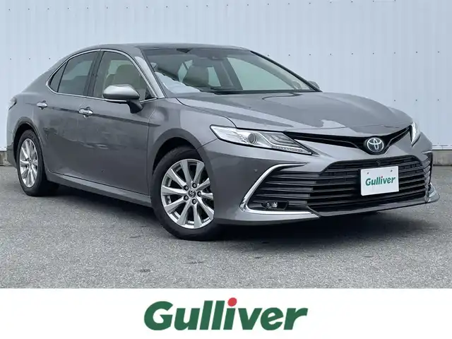 トヨタ カムリ G 福岡県 2021(令3)年 5.8万km グレー パノラミックビューモニター/サンルーフ/革シート/ＰＣＳ/ＪＢＬサウンド/純正９インチＤＡナビ/ＢＳＭ/ＲＣＴＡ/LDA/シートヒーター/ＨＵＤ/クリアランスソナー/レーダークルーズ/オートハイビーム/AC100V/ビルトインETC2.0/電動パーキング/ブレーキホールド/LEDヘッドライト/フォグランプ/純正アルミ/スマートキー/プッシュスタート