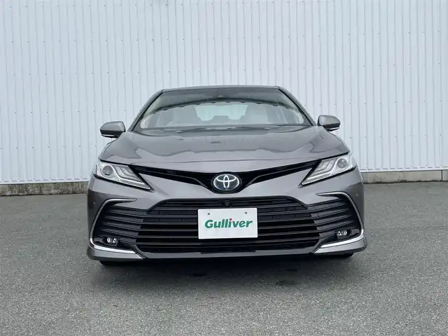 トヨタ カムリ G 福岡県 2021(令3)年 5.8万km グレー パノラミックビューモニター/サンルーフ/革シート/ＰＣＳ/ＪＢＬサウンド/純正９インチＤＡナビ/ＢＳＭ/ＲＣＴＡ/LDA/シートヒーター/ＨＵＤ/クリアランスソナー/レーダークルーズ/オートハイビーム/AC100V/ビルトインETC2.0/電動パーキング/ブレーキホールド/LEDヘッドライト/フォグランプ/純正アルミ/スマートキー/プッシュスタート