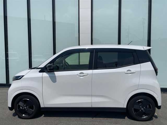 日産 サクラ X 大阪府 2023(令5)年 1.7万km ホワイトパール 純正ディスプレイオーディオ　/ターボ車　/Ｂｌｕｅｔｏｏｔｈ　/純正マット　/バックカメラ　/ベンチシート　/純正アルミホイール　/オートライト　/ＬＥＤライト　/プラグインハイブリット車 /PHEV /HDDナビ/ワンオーナー