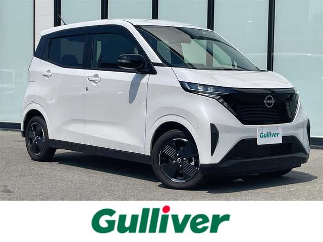 日産 サクラ X 大阪府 2023(令5)年 1.7万km ホワイトパール 純正ディスプレイオーディオ　/ターボ車　/Ｂｌｕｅｔｏｏｔｈ　/純正マット　/バックカメラ　/ベンチシート　/純正アルミホイール　/オートライト　/ＬＥＤライト　/プラグインハイブリット車 /PHEV /HDDナビ/ワンオーナー