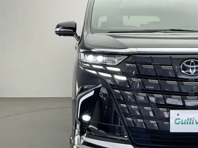 トヨタ アルファードハイブリット Z 愛知県 2023(令5)年 1.5万km ブラック 純正１４型ナビ　左右独立ムーンルーフ　モデリスタエアロ　トヨタチームメイト　アドバンスドパーク　カラーＨＵＤ　純正１２．１後席モニター　デジタルインナーミラー　ＨＤＭＩ　ＡＣ１００Ｖ　衝突軽減　禁煙車　モデリスタREGAL DIGNITY STYLE+クールシャインキット　モデリスタシグネチャーイルミブレード　イルミルーフスポイラー　寒冷地仕様　パワーバックドア　黒レザーシート　シートヒーター　シートベンチレーション　ステアリングヒーター　オットマン　前後ドラレコ　　セーフティセンス　BSM　車線逸脱　追従クルコン　パノラミックビューモニター　コーナーセンサー　