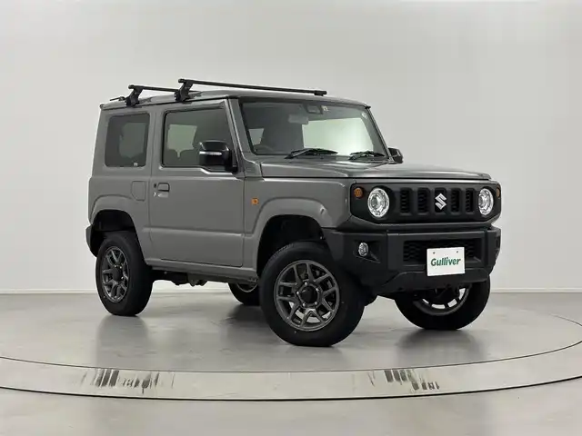 スズキ ジムニー XC 埼玉県 2022(令4)年 1.3万km ミディアムグレー 4WD/衝突被害軽減システム/社外マフラー（純正積み込み）/社外エアクリーナー（純正積み込み）/社外サス（純正積み込み）/社外オーディオDEH-5600/クルーズコントロール/オートLEDヘッドライト/電動格納ウィンカーミラー/シートヒーター/ETC/ルーフキャリア/純正フロアマット/背面タイヤ/スマートキー/プッシュスタート