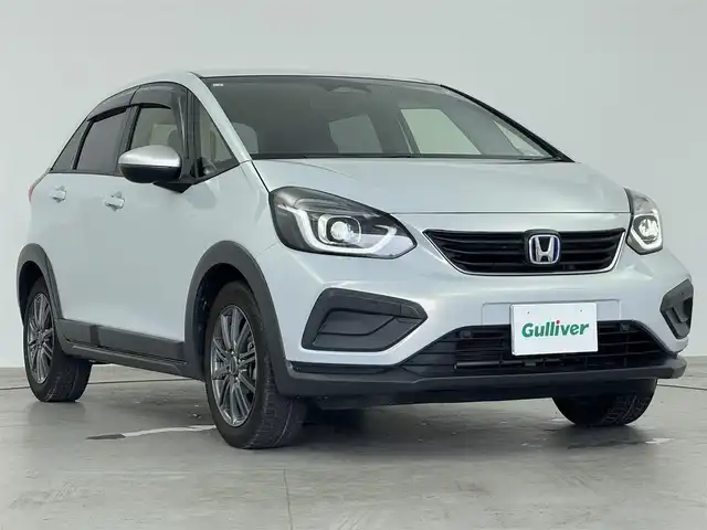 ホンダ フィット e:HEVクロスター 愛知県 2020(令2)年 5.6万km プレミアムサンライトホワイトパール 純正9インチナビ　/（フルセグ/BT/CD/DVD） /レーダークルーズコントロール　/バックモニター　/コーナーセンサー　/衝突軽減システム　/レーンキープアシスト　/オートライト　/電動格納ミラー　/ドライブレコーダー　/ETC/社外AW（BALMINUM）　