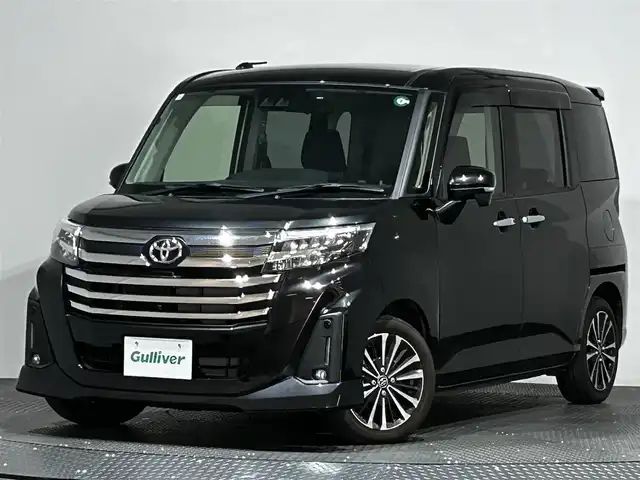 トヨタ ルーミー カスタムG－T 愛媛県 2023(令5)年 1.4万km ブラックマイカメタリック ・９型ナビ（フルセグＴＶ・ＢＴ・ＡＭＦＭ・ＣＤＤＶＤ・ＵＳＢ・ＳＤ・ＨＤＭＩ）/・全方位カメラ　/・ビルトインＥＴＣ２．０　/・前方ドラレコ　/・ＤＮ席シートヒーター　/・レーダークルーズコントロール　/・両側電動ドア/・前後コーナーセンサー/・衝突軽減ブレーキ/・レーンキープアシスト