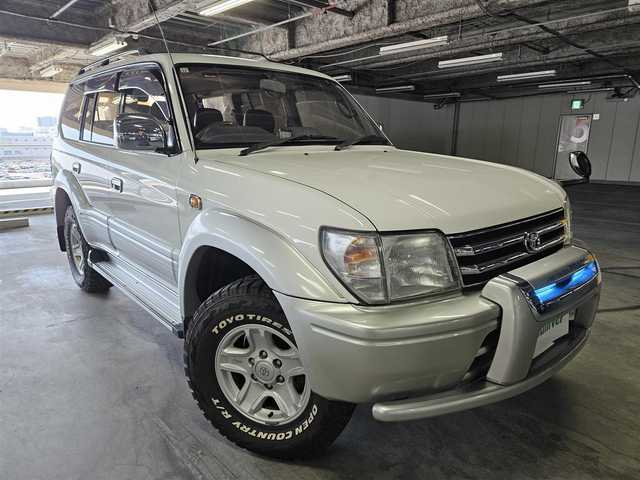 トヨタ ランドクルーザー プラド TX ワイド パッケージⅢ 群馬県 1998(平10)年 7.4万km ホワイト/シルバーM 〇社外ナビ/〇地上デジタルTV/〇バックカメラ/〇ムーンルーフ/〇ルーフレール/〇オートエアコン/〇シートカバー付/〇純正16インチアルミ/〇キャンピング/〇禁煙車