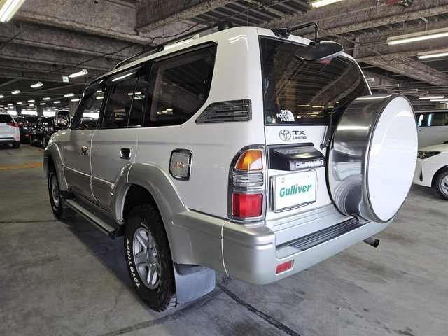 トヨタ ランドクルーザー プラド TX ワイド パッケージⅢ 群馬県 1998(平10)年 7.4万km ホワイト/シルバーM 〇社外ナビ/〇地上デジタルTV/〇バックカメラ/〇ムーンルーフ/〇ルーフレール/〇オートエアコン/〇シートカバー付/〇純正16インチアルミ/〇キャンピング/〇禁煙車