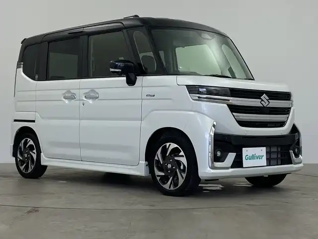 スズキ スペーシア カスタム HYBRID XS 鹿児島県 2024(令6)年 1.5万km ピュアホワイトパール/ブラック2トーン ワンオーナー/純正9インチナビ/（フルセグTV/BT/Applecarplay）/全方位モニター/ドライブレコーダー/デュアルセンサーブレーキサポート/レーンキープアシスト/ブレーキホールド/LEDライト/フォグLEDライト/ビルトインETC/ハーフレザーシート/シートヒーター（D＋N）/オットマン/両側パワースライドドア/純正15インチアルミホイール/アイドリングストップ/横滑り防止機能/フロアマット/ドアバイザー