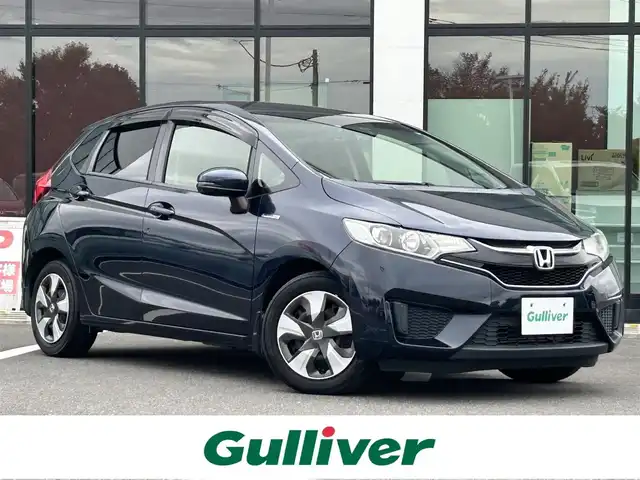 ホンダ フィット ハイブリット Lパッケージ 栃木県 2015(平27)年 7.6万km ミッドナイトブルービームM ホンダセンシング/純正7インチナビ/フルセグTV/DVD/Bluetooth/バックカメラ/ビルトインETC/前ドライブレコーダー/クルーズコントロール/プッシュスタート/ステアリングリモコン/LEDオートライト/アイドリングストップ/横滑り防止装置/純正フロアマット/ドアバイザー/電動格納ミラー