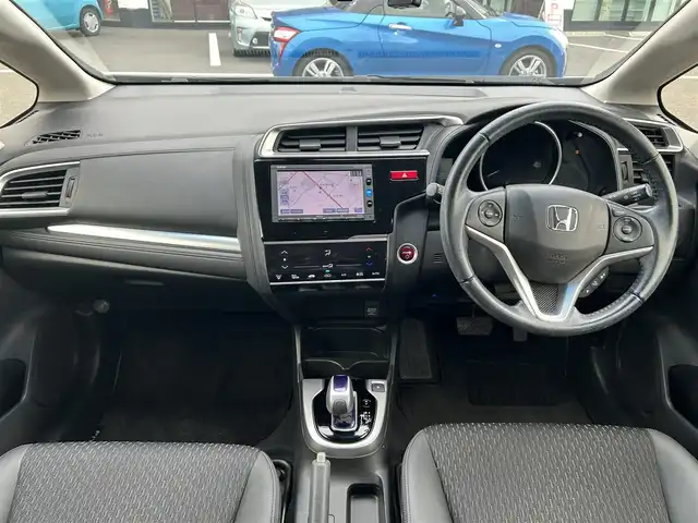 ホンダ フィット ハイブリット Lパッケージ 栃木県 2015(平27)年 7.6万km ミッドナイトブルービームM ホンダセンシング/純正7インチナビ/フルセグTV/DVD/Bluetooth/バックカメラ/ビルトインETC/前ドライブレコーダー/クルーズコントロール/プッシュスタート/ステアリングリモコン/LEDオートライト/アイドリングストップ/横滑り防止装置/純正フロアマット/ドアバイザー/電動格納ミラー