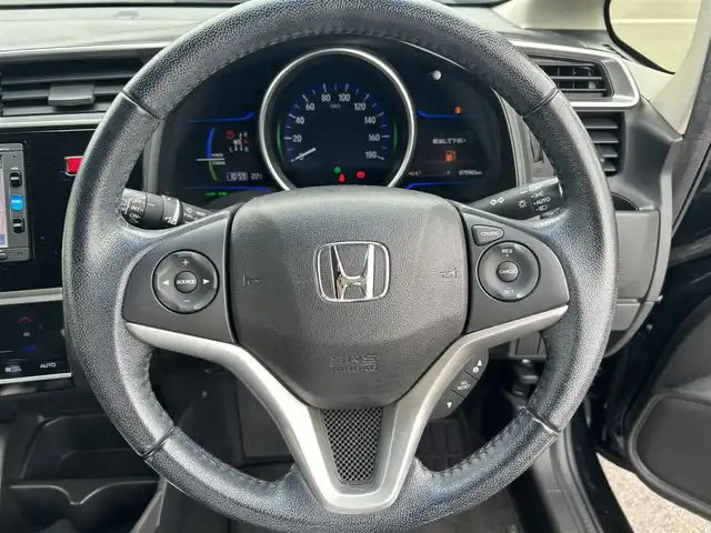 ホンダ フィット ハイブリット Lパッケージ 栃木県 2015(平27)年 7.6万km ミッドナイトブルービームM ホンダセンシング/純正7インチナビ/フルセグTV/DVD/Bluetooth/バックカメラ/ビルトインETC/前ドライブレコーダー/クルーズコントロール/プッシュスタート/ステアリングリモコン/LEDオートライト/アイドリングストップ/横滑り防止装置/純正フロアマット/ドアバイザー/電動格納ミラー