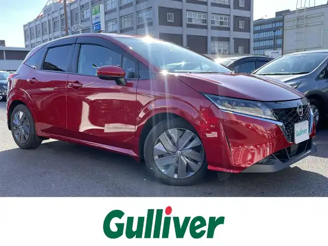 日産 ノート e－パワー X 島根県 2021(令3)年 3.3万km ガーネットレッド プロパイロット　/・レーダークルーズコントロール/・レーンアシスト/純正９インチメモリナビ　/(AM/FM/フルセグTV/Ｂｌｕｅｔｏｏｔｈ接続)/全方位／バックカメラ　/前方ドライブレコーダー　/ビルトインＥＴＣ2.0　/後側方車両検知警報/前後コーナーセンサー/インテリジェントエマージェンシーブレーキ　/電動パーキングブレーキ/オートホールド　/オートハイビーム／ライト　/置くだけ充電　/スマートキー/純正フロアマット/保証書・取扱説明書（本体＋ナビ）/スペアキー1本