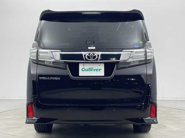トヨタ ヴェルファイア Z Gエディション 新潟県 2015(平27)年 8.1万km バーニングブラッククリスタルシャインガラスフレーク プリクラッシュセーフティ/レーダークルーズントロール/インテリジェントクリアランスソナー/純正9インチディーラーOPナビ（NSZT-Y64T）/　・バックカメラ/　・フルセグTV/　・Bluetooth/　・HDMI/　・CD/DVD/SD再生機能/フリップダウンモニター/ビルトインETC/電動リアゲート/両側パワースライドドア/前席パワーシート/D席メモリシート/オートライト/LEDヘッドライト/プッシュスタート/ステアリングヒーター/ステアリングスイッチ/オートドアミラー/アイドリングストップ/純正フロアマット/ドアバイザー
