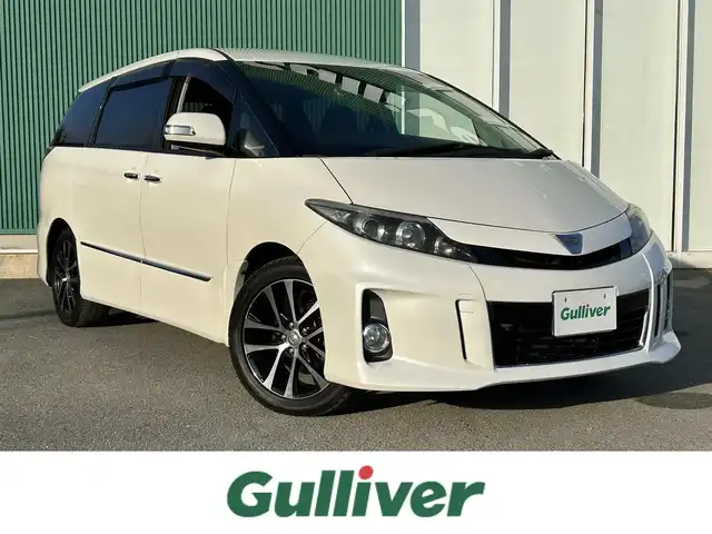 トヨタ エスティマ アエラス プレミアムエディション 福岡県 2013(平25)年 9万km ホワイトパールクリスタルシャイン ワンオーナー/HDDナビ/・バックカメラ/・フルセグTV/・BT/・CD/DVD/ビルトインETC/クルコン/両側パワスラ/前方ドラレコ/純正フロアマット/純正AW/HIDヘッドライト/オートライト/ハーフレザーシート/オットマン/三列シート/パワーシート(D席)