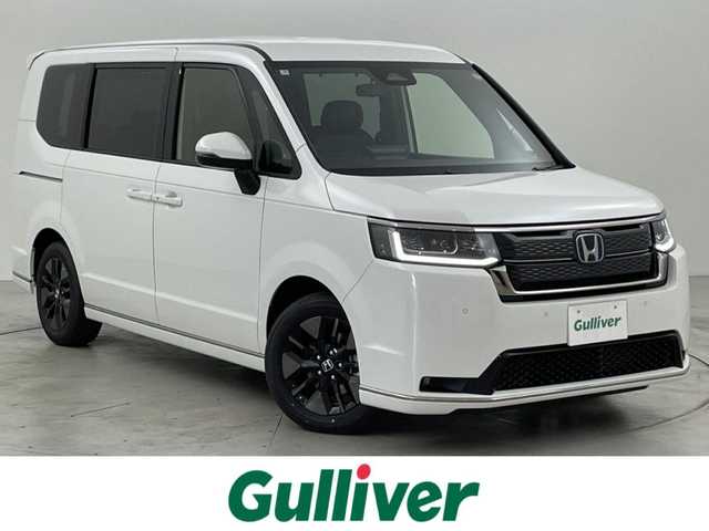 ホンダ ステップワゴン スパーダ eHEV 福岡県 2025(令7)年 0.1万km未満 プラチナホワイトパール 登録済未使用車　/純正ナビ　/Ｂカメラ　/ＡＣＣ　/コーナーセンサー　/衝突軽減　/レーンキープ　/ＢＳＭ　/踏み間違い防止　/パドルシフト　/両側電動スライドドア　/ハーフレザー　/シートヒーター　/パワーバックドア　/ＬＥＤ