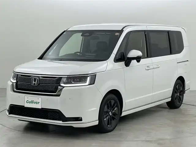 ホンダ ステップワゴン スパーダ eHEV 福岡県 2025(令7)年 0.1万km未満 プラチナホワイトパール 登録済未使用車　/純正ナビ　/Ｂカメラ　/ＡＣＣ　/コーナーセンサー　/衝突軽減　/レーンキープ　/ＢＳＭ　/踏み間違い防止　/パドルシフト　/両側電動スライドドア　/ハーフレザー　/シートヒーター　/パワーバックドア　/ＬＥＤ