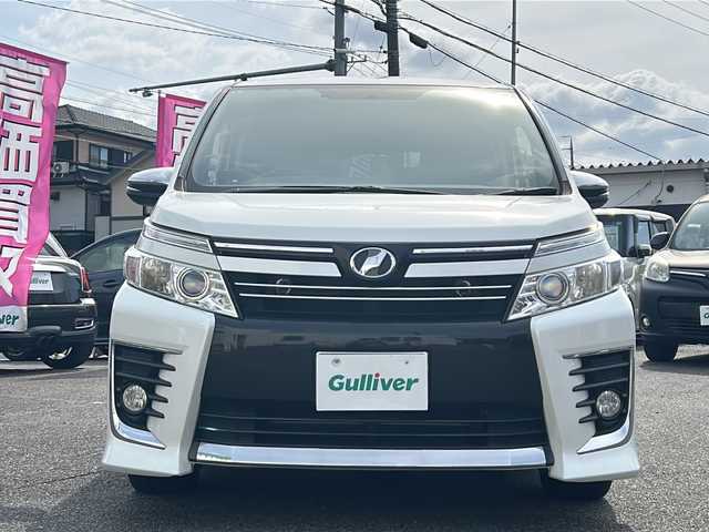トヨタ ヴォクシー ZS 煌 愛知県 2015(平27)年 10.1万km ホワイトパールクリスタルシャイン /禁煙車//純正９インチナビ・フルセグTV/　(NSZT-Y64T)//ビルトインETC//バックカメラ//両側パワースライドドア//前後ドライブレコーダー//純正フリップダウンモニター/　(V11T-R62G)//LEDオートライト//プッシュスタート//モデリスタ１５インチアルミ//社外テールレンズ//電動格納ミラーウインカー//純正ドアバイザー//純正フロアマット//新車保証書