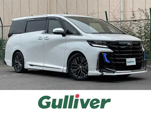 トヨタ ヴェルファイア ハイブリット Z プレミア 東京都 2023(令5)年 3万km プラチナホワイトパールマイカ メーカーナビ　/サンルーフ　/モデリスタエアロ　/置くだけ充電　/レーダークルーズコントロール/４WD　/前後ドラレコ/フルセグTV/シートメモリー　/電動リアゲート　/シートヒーター　/ベンチレーション　/本革シート　/純正フロアマット/純正アルミホイール/ＥＴＣ２．０/ABS/横滑り防止装置/レーンアシスト/パーキングサポート/ＢＳＭ　/ＨＵＤ　/盗難防止装置/オートマチックハイビーム/衝突軽減ブレーキ/安心降車アシスト/リヤカメラディテクション/プロアクティブドライビングアシスト/ロードサインアシスト
