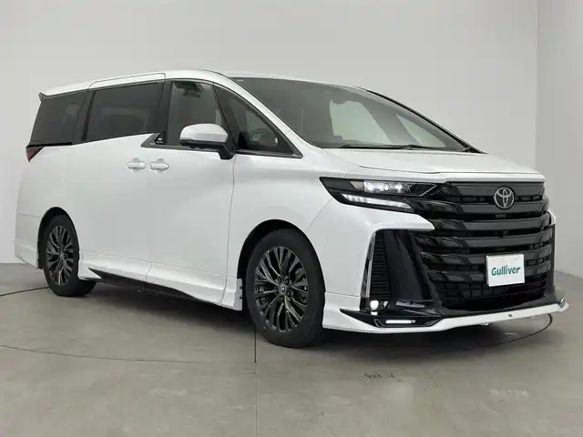 トヨタ ヴェルファイア ハイブリット Z プレミア 愛知県 2024(令6)年 0.7万km プラチナホワイトパールマイカ ＧＲエアロ　/茶革シート　/ユニバーサルステップ　/トヨタチームメイト　/ムーンルーフ　/デジタルインナーミラー　/カヘッドアップディスプレイ/14型ディスプレイオーディオ/13.2型有機ＥＬ後席ディスプレイ　/アラウンドビュー　/デジタルインナーミラー　/ＢＳＭ　/衝突軽減/レーダークルーズ/ETC２．０/シートシートヒーター/ベンチレーション/置くだけ充電/AC１００V/HDMI/タイプC/ドライブレコーダー/パワーバックドア