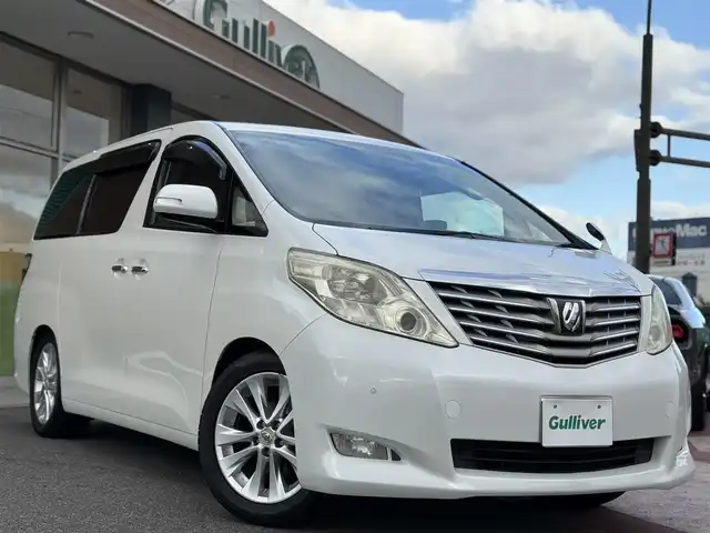 トヨタ アルファード 240G 香川県 2011(平23)年 9.8万km ホワイトパールクリスタルシャイン 社外HDDナビ/フルセグ/アルパインフリップダウンモニター/ダブルサンルーフ/両側パワースライドドア/クルーズコントロール/革調シートカバー/社外テール/ローダウン/ビルトインETC/スマートキー