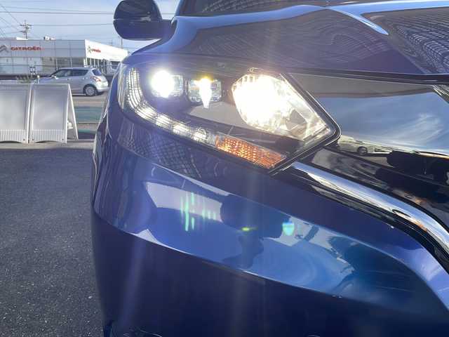 ホンダ ヴェゼル ハイブリッド RS ホンダセンシング 愛知県 2017(平29)年 3.5万km モルフォブルーP 純正HDDナビ/【フルセグ・DVD再生可・CD・Bluetooth】/バックカメラ/ビルトインETC/ホンダセンシング/【アダプティブクルーズコントロール・車線維持支援システム・路外逸脱抑制機能・歩行者事故逓減ステアリング・標識認識機能・先行車発進お知らせ機能・衝突被害ブレーキ・誤発進抑制機能】/前方ドライブレコーダー/社外マフラー（ＮＯ－ＢＬＥＳＳＥ）　/ステアリングスイッチ　/純正フロアマット　/プッシュスタート/スマートキー/新車保証書/取扱説明書