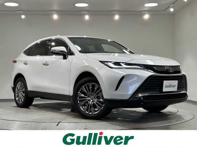 トヨタ ハリアー Z レザーパッケージ 愛知県 2022(令4)年 1.8万km プラチナホワイトパールマイカ 純正１２．３インチディスプレイオーディオ/ＪＢＬプレミアムサウンド/パノラミックビューモニター/ヘッドアップディスプレイ/パワーバックドア/レーダークルーズコントロール/プリクラッシュセーフティ/レーントレーシングアシスト/ブラインドスポットモニター/クリアランスソナー/先行車発進告知/ワイヤレス充電/デジタルインナーミラー【ドラレコ機能付】/ビルトインETC2.0/USB＆HDMI入力端子/アクセサリーソケット/シートクーラー/シートヒーター/パワーシート【シートメモリー機能付】/社外フロアマット/純正19インチアルミホイール