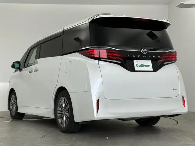 トヨタ アルファードハイブリット Z 愛知県 2024(令6)年 2.1万km プラチナホワイトパールマイカ 13.2型有機EL後席ディスプレイ　/純正14型メモリナビ/（FM/AM/BT/フルセグTV）　/全方位バックカメラ　/合皮シート　/前席＋二席目シートベンチレーション/前席＋二席目シートヒーター　/前席＋二席目パワーシート/ステアリングヒーター　/置くだけ充電　/デジタルインナーミラー　/ETC2.0/電動リアゲート/トヨタセーフティセンス/・プリクラッシュセーフティ/・レーンキープアシスト/・ブラインドスポットモニター/・ヘッドアップディスプレイ/・クリアランスソナー/・パーキングサポートブレーキ/・ロードサインアシスト/・レーダークルーズコントロール/・アダクティブハイビームシステム/・両側パワースライドドア/・純正19インチAW/・純正LEDヘッドライト/・純正フロアマット
