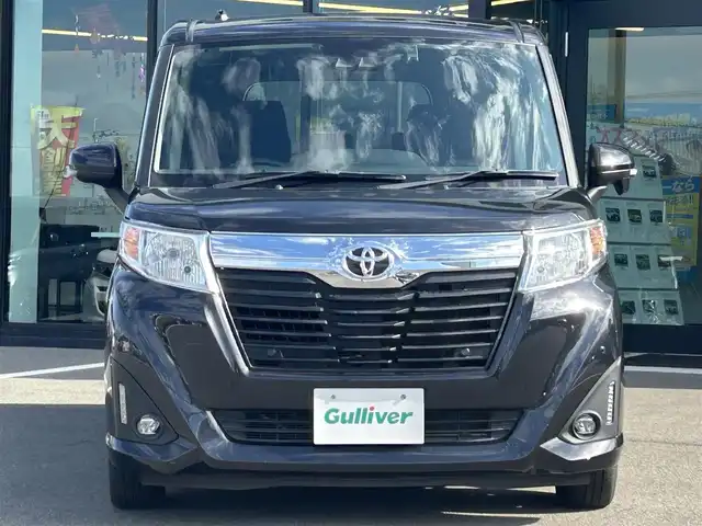 トヨタ ルーミー G－T 愛媛県 2020(令2)年 2.6万km ブラックマイカメタリック 純正9型ナビ/純正12.1型フリップダウンモニター/両側パワースライドドア/純正ドライブレコーダー/バックカメラ/クルーズコントロール/アイドリングストップ/衝突被害軽減装置/車線逸脱防止装置/クリアランスソナー/ステアリングリモコン/後席サンシェイド/電動格納ミラー/ヘッドライトレベライザー/シガーソケット/純正ホイールキャップ/現状サマー(鉄)(165/65/R14)/DUNLOP ENASAVE EC300+/禁煙車