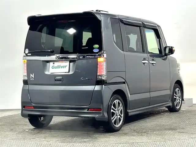 ホンダ Ｎ ＢＯＸ カスタム G SSパッケージ 大阪府 2014(平26)年 2.2万km ポリッシュドメタルメタリック 純正ナビ(地デジ/DVD再生/Bluetooth) 衝突軽減 両側パワースライドドア バックカメラ オートライト スマートキー プッシュスタート オートエアコン 電格ミラー ワンオーナー ABS