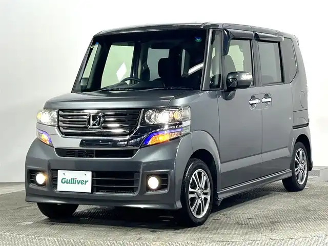 ホンダ Ｎ ＢＯＸ カスタム G SSパッケージ 大阪府 2014(平26)年 2.2万km ポリッシュドメタルメタリック 純正ナビ(地デジ/DVD再生/Bluetooth) 衝突軽減 両側パワースライドドア バックカメラ オートライト スマートキー プッシュスタート オートエアコン 電格ミラー ワンオーナー ABS