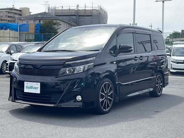 トヨタ ヴォクシー ZS G’s 静岡県 2016(平28)年 7.3万km ブラック ワンオーナー/社外ナビ/地デジTV/CD DVD Bluetooth/バックカメラ/フリップダウンリアモニター/セーフティセンス/オートハイビーム/レーンキープアシスト/両側パワースライドドア/純正18インチAW/ビルトインETC/スマートキー/スペアキー/保証書/取説