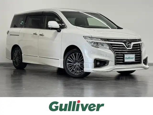 日産 エルグランド 250HWS アーバンクロム 三重県 2016(平28)年 4.1万km ブリリアントホワイトパール ガソリン/FF/純正 8インチ カーウイングスナビゲーションシステム*/（FM/AM/CD/DVD/MusicBox/TV/Bluetooth/AUX/USB/iPod）/純正 11インチ 後席モニター（リモコン・ワイヤレスヘッドホン付）*/インテリジェント アラウンドビューモニター（移動物検知機能付）/両側オートスライドドア/ドライブレコーダー 前方/ビルトイン ETC/安全/・アラモニ補助ソナー（前後）/・VDC（ビークルダイナミクスコントロール［TCS機能を含む］）＋ブレーキLSD/・SRS サイド＆カーテンエアバッグシステム/・EBD（電子制御制動力配分システム）/・ABS/など/装備/・100V電源*/・ハーフレザーシート/・オットマンシート（N/2nd）/・クルーズコントロール/・左右、前後独立オートエアコン/・オートライト/・アクティブAFS/・LEDヘッドライト ＆ フロントフォグライト/・ステアリングスイッチ/・電動格納ドアミラー/・プッシュスタート/・純正18inAW/・保/・スマートキーx1/など
