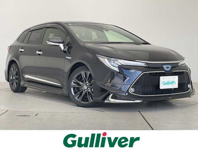 トヨタ カローラツーリング ハイブリッド ダブルバイビー 愛知県 2019(令1)年 2.2万km スパークリングブラックパールクリスタルシャイン モデリスタエアロ/純正9型ディスプレイオーディオナビ/レーダークルーズコントロール/シートヒーター/バックカメラ/コーナーセンサー/純正アルミホイール/ステアリングヒーター/LEDヘッドライト/オートマチックハイビーム/ドライブレコーダー/ETC/衝突軽減システム/フルセグ/Bluetooth/ステアリングスイッチ/スマートキー/プッシュスタート