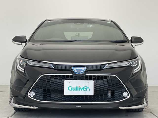 トヨタ カローラツーリング ハイブリッド ダブルバイビー 愛知県 2019(令1)年 2.2万km スパークリングブラックパールクリスタルシャイン モデリスタエアロ/純正9型ディスプレイオーディオナビ/レーダークルーズコントロール/シートヒーター/バックカメラ/コーナーセンサー/純正アルミホイール/ステアリングヒーター/LEDヘッドライト/オートマチックハイビーム/ドライブレコーダー/ETC/衝突軽減システム/フルセグ/Bluetooth/ステアリングスイッチ/スマートキー/プッシュスタート