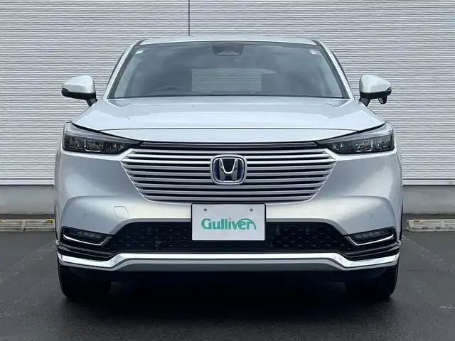 ホンダ ヴェゼル ハイブリッド e:HEV Z 秋田県 2023(令5)年 3.6万km プレミアムサンライトホワイトパール ４WD/衝突軽減システム/LEDヘッドライト/純正メモリナビ（DVD/CD/BT/AM/FM/USB）/フルセグ（走行中視聴可能）/バックカメラ/ホンダ純正１８インチアルミ（夏タイヤ装着）/スマートキー/アイドリングストップ/プッシュスタート/コーナーセンサー/レーンキープアシスト/クルーズコントロール追従走行あり/オートマチックハイビーム/ダウンヒルアシストコントロール/ステアリングスイッチ/ステアリングヒーター/パドルシフト/前席シートヒーター/ビルトインETC/電動リアゲート/電動パーキングブレーキ/オートブレーキホールド機能/純正フロアマット/社外ドアバイザー/オートライト/オートエアコン/パワーステアリング/パワーウィンドウ/横滑り防止/盗難防止装置/寒冷地仕様/電動格納ウィンカーミラー/保証書/取扱説明書/記録簿