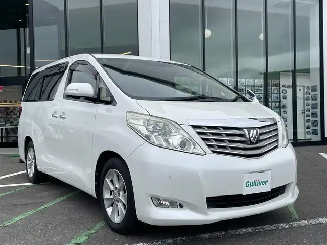 トヨタ アルファード 240G 長崎県 2008(平20)年 3.8万km ホワイトパールクリスタルシャイン 両側パワースライドドア/前席パワーシート/シートメモリー/純正HDDナビ/バックカメラ/クルーズコントロール/ウッドコンビハンドル/ETC/ドライブレコーダー前後/オートライト/キセノン/ステアリングスイッチ/オットマンシート/コーナーセンサー/スマートキー/スペアキー