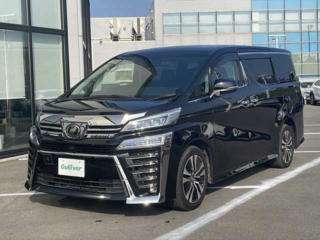 トヨタ ヴェルファイア Z Gエディション 青森県 2019(令1)年 6.7万km ブラック ・4WD/・本革シート/・純正SDナビ（アルパイン）/・フルセグ/・CD/DVD/SD/Bluetooth/・バックカメラ/・プッシュスタート/・スマートキー/・衝突被害軽減ブレーキ/・レーダークルーズコントロール/・レーンキープアシスト/・パワーバックドア/・コーナーセンサー/・横滑り防止/・LEDヘッドライト/・オートライト/・オートマチックハイビーム/・全席パワーシート/・前席エアシート/・シートメモリー/・オットマン/・ハンドルヒーター/・両側パワースライドドア/・純正ビルドインETC2.0/・純正ドライブレコーダー/・純正フロアマット/・純正ドアバイザー/・純正18AW/・保証書/・取扱説明書