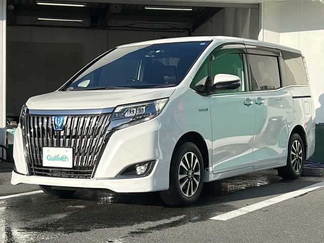トヨタ エスクァイア ハイブリッド Gi プレミアムパッケージ ブラックテーラード 京都府 2019(令1)年 6.7万km パール バックカメラ　純正ドラレコ　純正１０インチナビ　フルセグテレビ　ＥＴＣ２．０　両側パワースライドドア　ＬＥＤヘッドライト　シートヒーター　ステアリングヒーター　クルーズコントロール