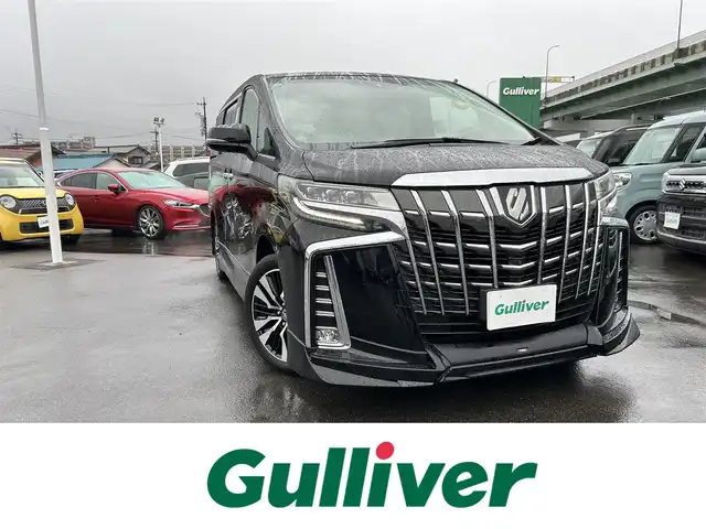 トヨタ アルファード SC 愛知県 2021(令3)年 1.9万km ブラック ワンオーナー/TRDエアロ（F・S・R）/デジタルインナーミラー/純正メーカーナビ/フルセグTV/BT/DVDデッキ/AC100V電源/JBLサウンド/パノラミックビューモニター/ビルトイン2.0ETC/純正18インチAW/トヨタセーフティセンス/レーダークルーズコントロール/ブラインドスポットモニター/前後ドライブレコーダー/両側パワースライドドア/パワーバックドア/レザーシート/前席パワーシート（D席めもりー付き）/前席シートヒーター/エアシート/オットマン/純正フロアマット/スペアタイヤ/取説、保証書/スペアキー