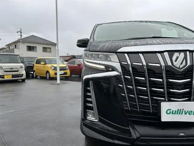 トヨタ アルファード SC 愛知県 2021(令3)年 1.9万km ブラック ワンオーナー/TRDエアロ（F・S・R）/デジタルインナーミラー/純正メーカーナビ/フルセグTV/BT/DVDデッキ/AC100V電源/JBLサウンド/パノラミックビューモニター/ビルトイン2.0ETC/純正18インチAW/トヨタセーフティセンス/レーダークルーズコントロール/ブラインドスポットモニター/前後ドライブレコーダー/両側パワースライドドア/パワーバックドア/レザーシート/前席パワーシート（D席めもりー付き）/前席シートヒーター/エアシート/オットマン/純正フロアマット/スペアタイヤ/取説、保証書/スペアキー