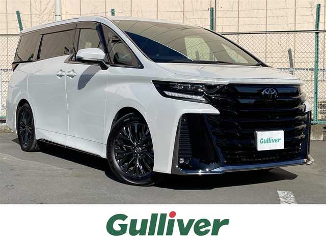 トヨタ ヴェルファイア ハイブリット Z プレミア 東京都 2023(令5)年 2.1万km プラチナホワイトパールマイカ ワンオーナー　/純正14型ディスプレィオーディオ/・BluetoothAudio/・AppleCarPlay/AndroidAuto/ムーンルーフ /ブラウンレザーシート/アラウンドビューモニター /パーキングサポートブレーキ/ブラインドスポットモニター /両側パワースライドドア /パワーバックドア /クリアランスソナー /アドバンストパーク/レーンチェンジアシスト/デジタルインナーミラー/スマホ置くだけ充電/パワーオットマンシート/保証書＆取説/スペアキーX1/ビルトインETC