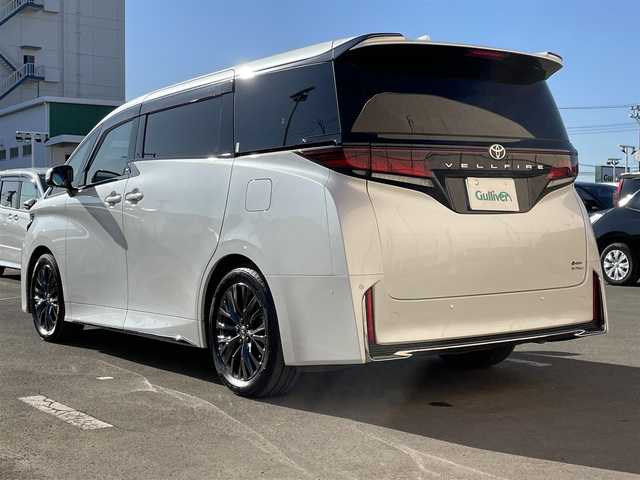 トヨタ ヴェルファイア ハイブリット Z プレミア 東京都 2023(令5)年 2.1万km プラチナホワイトパールマイカ ワンオーナー　/純正14型ディスプレィオーディオ/・BluetoothAudio/・AppleCarPlay/AndroidAuto/ムーンルーフ /ブラウンレザーシート/アラウンドビューモニター /パーキングサポートブレーキ/ブラインドスポットモニター /両側パワースライドドア /パワーバックドア /クリアランスソナー /アドバンストパーク/レーンチェンジアシスト/デジタルインナーミラー/スマホ置くだけ充電/パワーオットマンシート/保証書＆取説/スペアキーX1/ビルトインETC