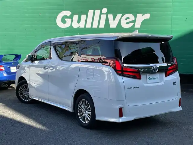 トヨタ アルファードハイブリット S タイプゴールドⅡ 東京都 2021(令3)年 1.7万km ホワイトパールクリスタルシャイン ワンオーナー/純正ナビ/・フルセグTV/Bluetooth/DVD/Tコネクト/JBLプレミアムサウンド/ツインムーンルーフ/フリップダウンモニター/デジタルインナーミラー/パノラミックビューモニター/両側電動スライドドア/電動リアゲート/純正ドライブレコーダー（DRD-H68)/セーフティセンス/レーダークルーズコントロール/レーンキープアシスト/衝突軽減システム/前後コーナーセンサー/LEDライト/フロントフォグランプ/オートハイビーム/オットマン/スペアキー×1/ETC2.0/保証書/取扱説明書/記録簿